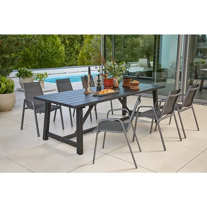 Sunfun Gartenmöbel-Set Melina/Gastro - 7 -tlg., Akazie, Stahl, Textilen, Schwarz/Night-Grey - Einladende Gartenszene mit einem stilvollen Esstisch-Set und passenden Stühlen im Freien, perfekt für gesellige Stunden.