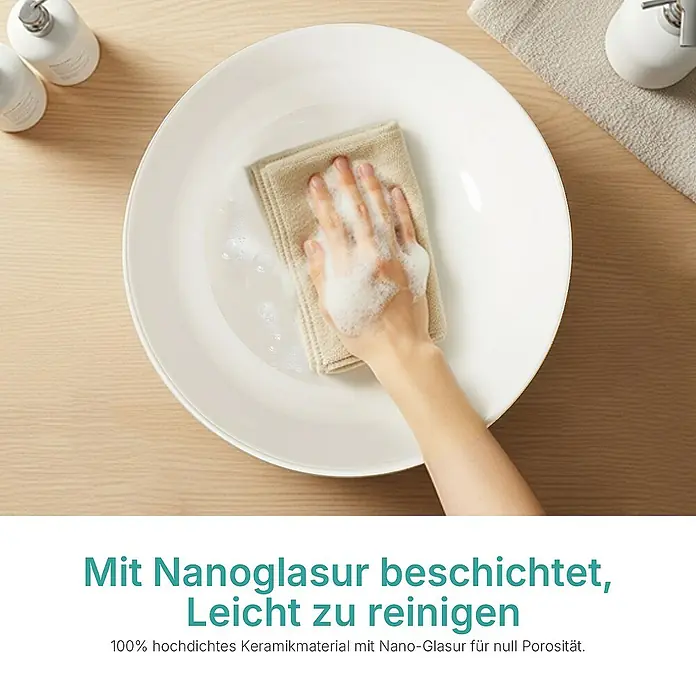 Emke Aufsatzwaschbecken CB30 - 41 x 41 cm, Hahnloch: Ohne, Ohne Überlauf, Weiß - Eine Hand reinigt ein weißes Keramikbecken mit einem Tuch und Seife. Das Becken ist mit einer Nanoglasur beschichtet und leicht zu reinigen.