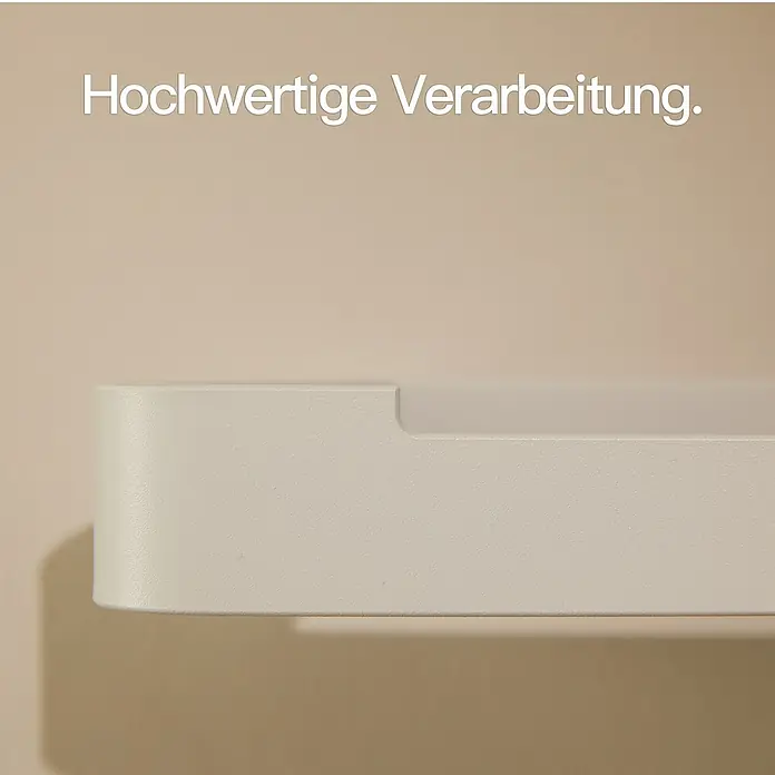 Designfabrik Hamburg Toilettenpapierhalter - Weiß, Matt - Hochwertige Verarbeitung: Nahaufnahme eines eleganten, weißen Produkts mit glatter Oberfläche vor einem beigen Hintergrund.