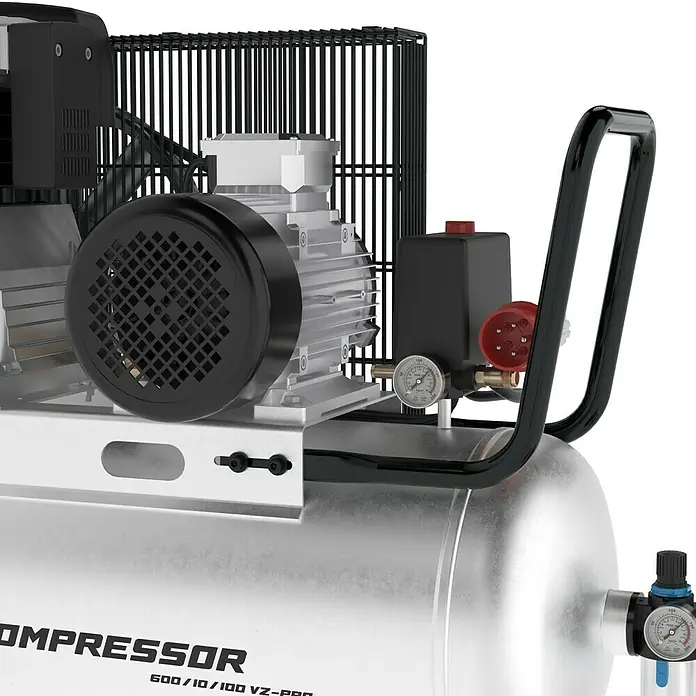 Güde Kompressor 600/10/100 VZ-PRO - 4.000 W, Max. Druck: 10 bar, 100 l, Schmierung: Ölgeschmiert - Detailansicht eines silbernen Luftkompressors mit schwarzem Motorschutzgitter, Druckanzeige und Tragegriff.