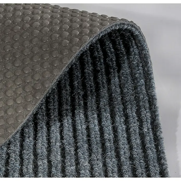 Fußmatte Rib Line Mini Sprint - Grau, 60 x 25 cm, 100 % Polypropylen - Detailaufnahme einer grauen Schmutzfangmatte mit Noppenstruktur, die für Sauberkeit und Rutschfestigkeit im Eingangsbereich sorgt.