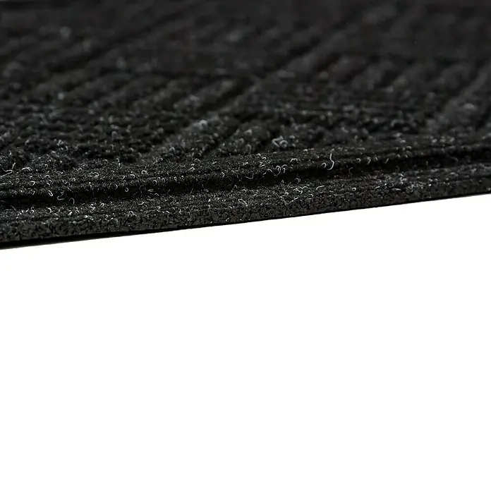 Fußmatte Nub Star - Anthrazit, 63 x 43 cm, 90 % Polyester, 10 % Polypropylen - Detailaufnahme einer schwarzen, strukturierten Schmutzfangmatte. Die Matte hat ein Rillenmuster und eine robuste Oberfläche.
