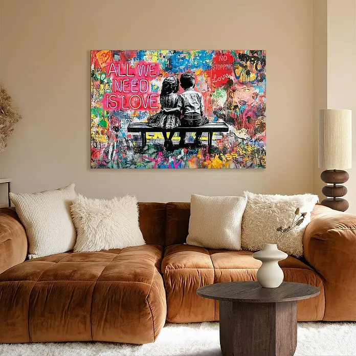Reinders Glasbild All We need is love - All We need is love, B x H: 78 x 116 cm - Wohnzimmer mit braunem Sofa und einem farbenfrohen Wandbild mit der Aufschrift "All we need is love".