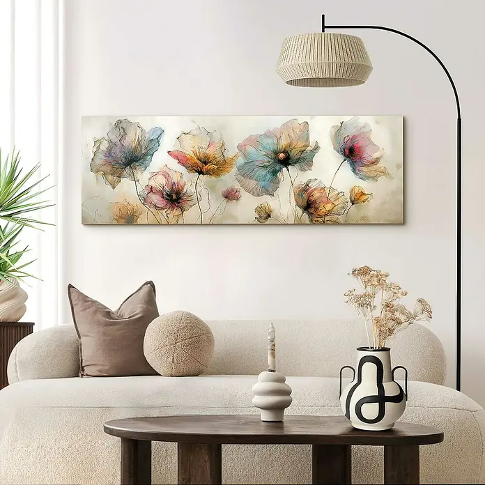 Reinders Glasbild Aquarel Flowers - Aquarel Flowers, B x H: 52 x 156 cm - Wohnzimmer mit einem horizontalen Blumenbild in zarten Farben über einem beigen Sofa mit Kissen und einem dunklen Holztisch.