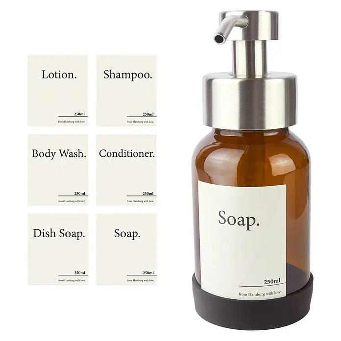 Designfabrik Hamburg Seifenspender - Edelstahl, Silber/Braunglas - Bild einer Seifenspender-Kollektion mit minimalistischem Design, inklusive Lotion, Shampoo, Spülmittel und mehr.