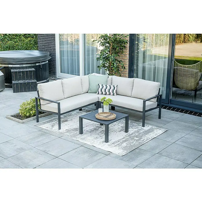 Garden Impressions Loungemöbel-Set - 4 -tlg., Aluminium, Ecklounge, Grau/Schwarz - Stilvolle graue Gartenlounge-Garnitur mit beigen Kissen und einem passenden Tisch auf einem gemusterten Teppich im Außenbereich.
