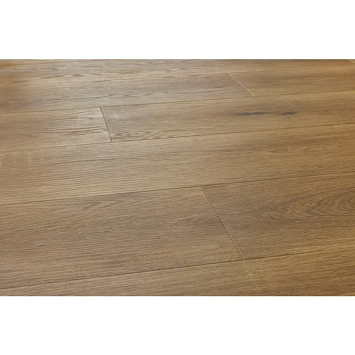 Vinylboden SPC Silent - Frisco Eiche, Landhausdiele, 1.220 x 229 x 5,3 mm - Nahaufnahme von Laminatboden mit Holzmaserung und warmen Farbtönen, der die natürliche Schönheit des Materials betont.