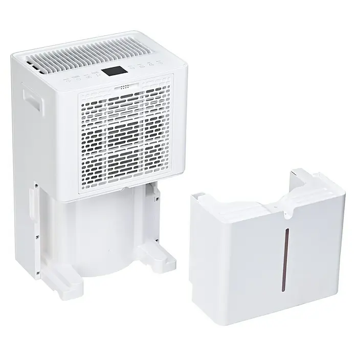 Corberó Deshumidificador eléctrico CDG20 - 380 W, Potencia de deshumidificación: 20 l/día, L x An x Al: 23,5 x 31 x 50 cm, Blanco - Imagen de un deshumidificador blanco con un depósito de agua extraíble colocado junto a la unidad.\n