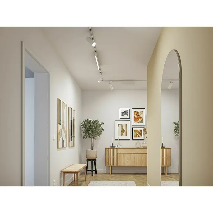 Paulmann URail Foco LED para riel Spot Theron - 13 W, Blanco, Blanco neutro, 6,2 x 20 cm, 4.000 K - Interior luminoso con un moderno aparador de madera, adornado con obras de arte y una planta, creando un ambiente acogedor.