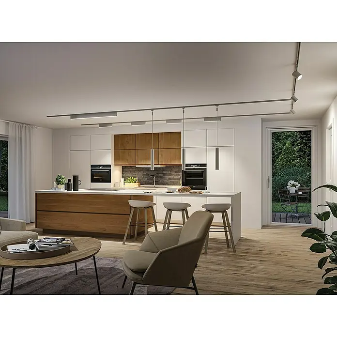Paulmann URail Lámpara fluorescente LED Zelos - L x An x Al: 2,3 x 37,2 x 7,4 cm, Color de luz: Blanco cálido, Plata - Un salón moderno con cocina abierta e iluminación elegante. La iluminación crea un ambiente cálido y acogedor.