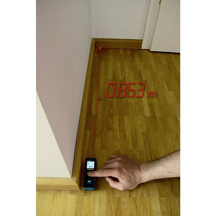 Wisent Laserentfernungsmesser - Messbereich: 0,2 - 20 m - Ein Lasermessgerät wird verwendet, um die Länge einer Wand mit einem roten Laserstrahl anzuzeigen, der 0,863 m misst.