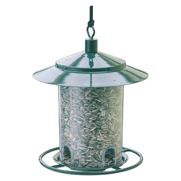 Windhager Vogelfutterhaus - 17,5 x 22,5 cm, Grün - Dieses Bild zeigt einen grünen Vogelfutterspender voller Sonnenblumenkerne, ideal, um Vögel in Ihren Garten zu locken und zu füttern.