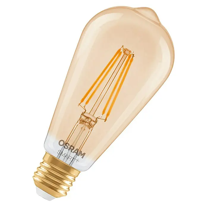 Osram Smart+ Smart-LED-Lampe Edison matter - E27, Dimmbar, Warmweiß, 680 lm, 6 W - Nahaufnahme einer OSRAM SMART+ Vintage-Glühbirne mit goldfarbenem Sockel und filigranen Filamenten. Das warmweiße Licht sorgt für eine gemütliche Atmosphäre.