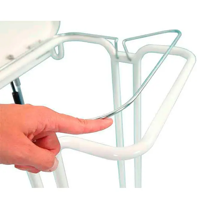 Proregal Müllsackständer mit Deckel und Fußpedal -  - Nahaufnahme eines Zahnarztstuhls mit einer Hand, die eine Metallschiene berührt. Komfort und Design für Zahnarztpraxen.