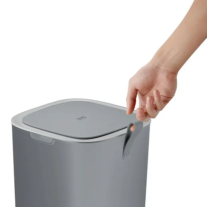 Proregal Sensormülleimer Moderner quadratischer Abfalleimer mit Smart Sensor - 30 l, Kunststoff, Grau - Grauer EKO-Mülleimer mit Deckel, der von einer Hand geöffnet wird. Der Mülleimer hat ein schlichtes, modernes Design und einen praktischen Griff.