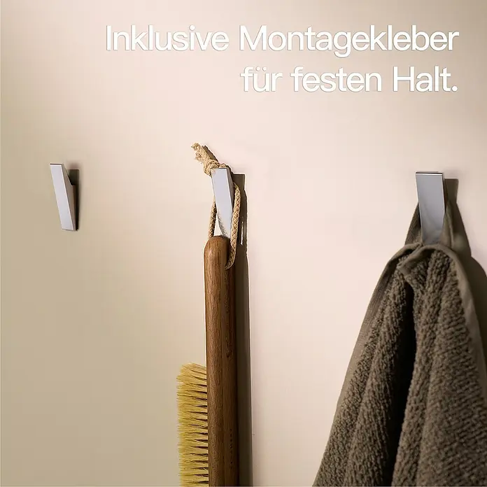 Designfabrik Hamburg Handtuchhaken - 4 Stk., Chrom, Glänzend - Wandhaken aus Metall mit Handtuch, Bürste und Text "Inklusive Montagekleber für festen Halt".