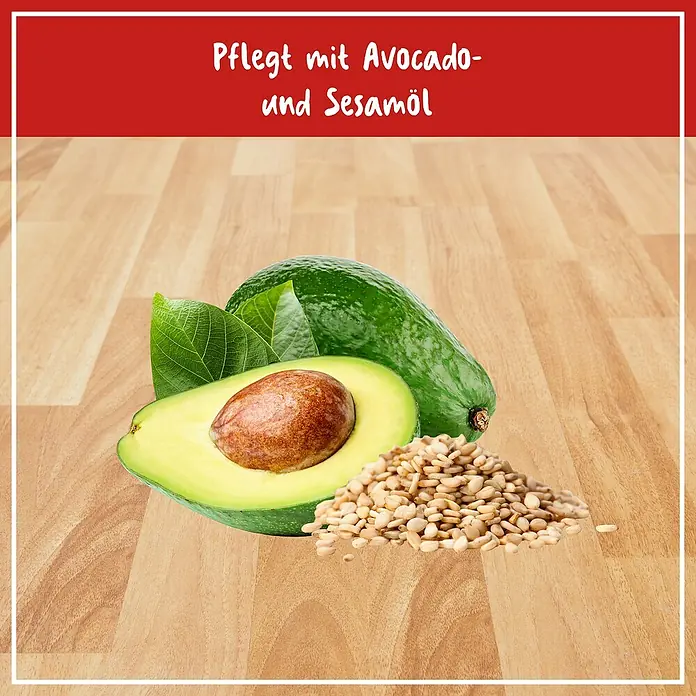 Poliboy Reinigungskonzentrat Parkett - 500 ml, Flasche - Bild mit Avocado, halber Avocado mit Kern, Blätter und Sesamkörner, die die pflegenden Eigenschaften von Avocado- und Sesamöl hervorheben.