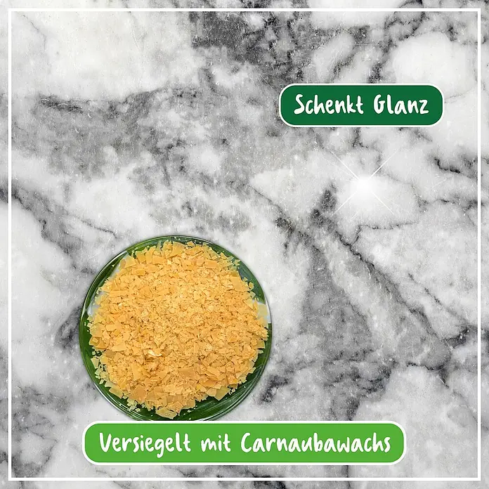 Poliboy Pflegemittel Marmor Granit Pflege - 500 ml, Flasche - Nahaufnahme von Carnaubawachs-Flocken in einer Glasschale, die "Glanz verleihen" und mit Carnaubawachs versiegelt sind.