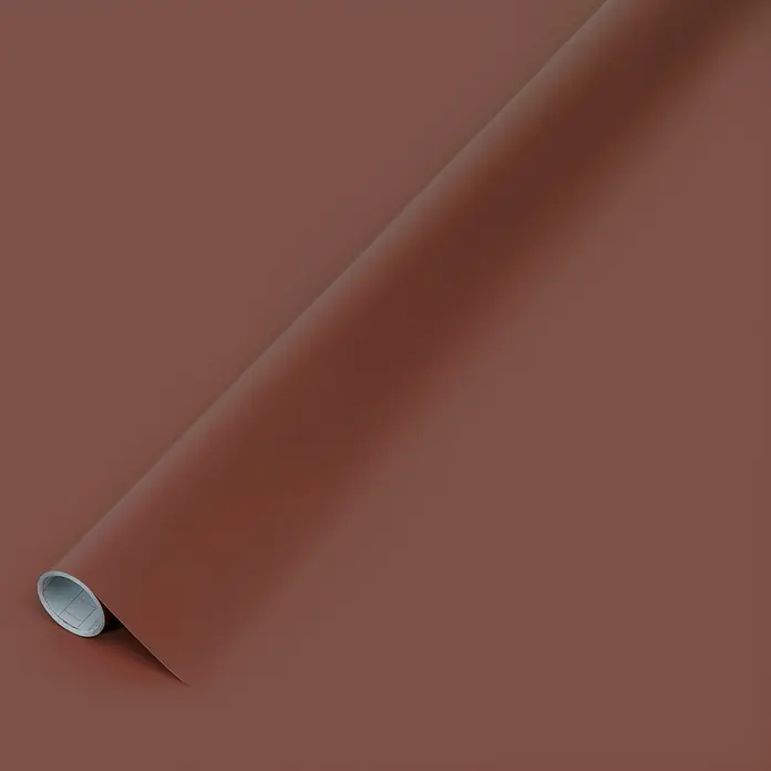 D-c-fix Klebefolie Uni Seidenmatt - 200 x 45 cm, Rost-Rot, Selbstklebend - Ein aufgerolltes, sattes, braunes Papier, das eine warme und einladende Ästhetik für Bastel- und Dekorationsprojekte bietet.