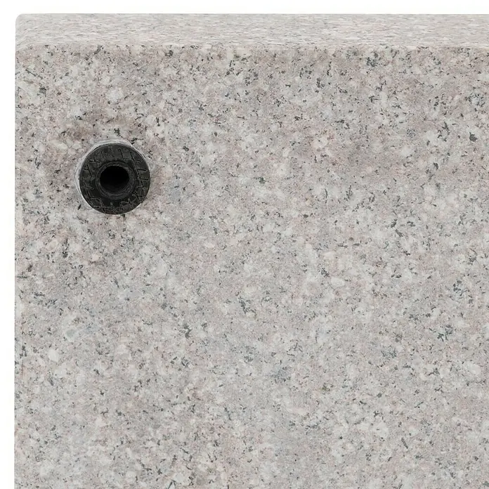 Doppler Rollen-Set Life - Passend für: Doppler Granitschirmständer Life, 4 Stk. - Nahaufnahme eines grauen Granitblocks mit einer schwarzen Gummidichtung, ideal für architektonische oder dekorative Anwendungen.