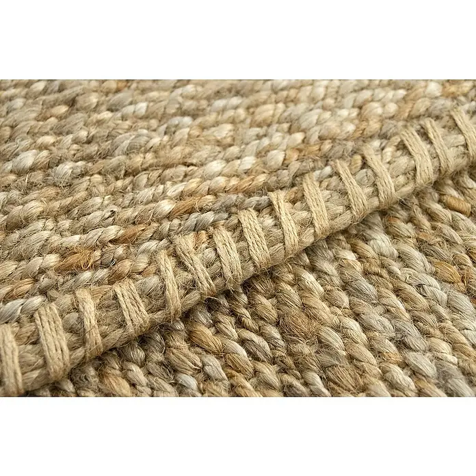 Alfombra de yute Córdoba - Natural, 360 x 220 cm, 100% yute - Primer plano de una alfombra de fibra natural con textura trenzada y borde decorativo. Ideal para crear un ambiente acogedor.