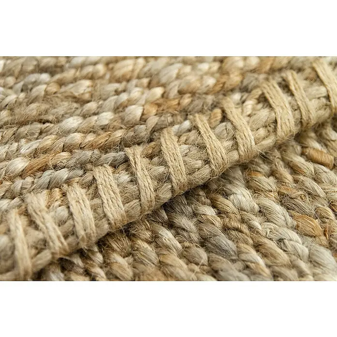 Alfombra de yute Córdoba - Natural, 360 x 220 cm, 100% yute - Primer plano de una alfombra de yute trenzada, que muestra la textura y el patrón de este revestimiento de suelo. Tonos naturales para un ambiente acogedor.