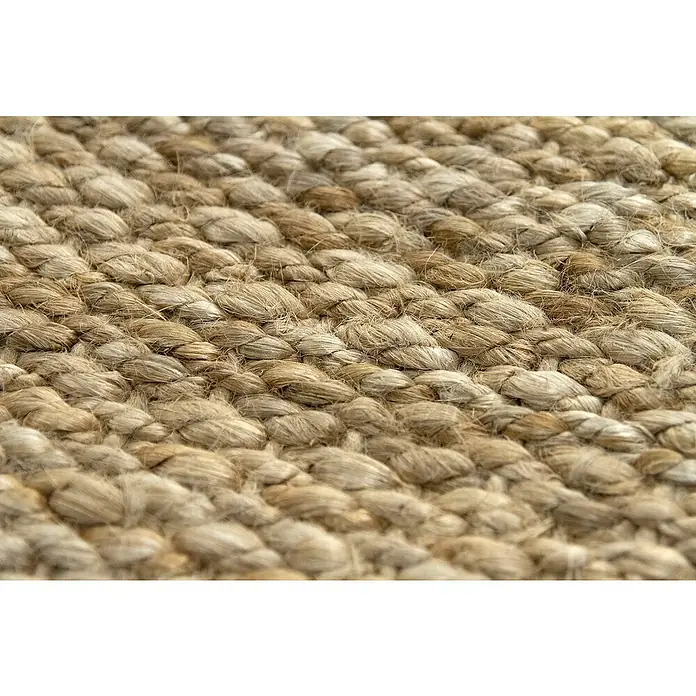 Alfombra de yute Córdoba - Natural, 360 x 220 cm, 100% yute - Primer plano de una alfombra de yute tejida, destacando la textura y el patrón del material natural. Revestimiento rústico.
