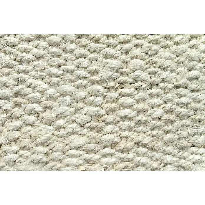 Alfombra de yute Córdoba - Blanco, 300 x 240 cm, 100% yute - Primer plano de una alfombra tejida con una superficie densa y texturizada en un tono claro y neutro, que evoca calidez y confort.