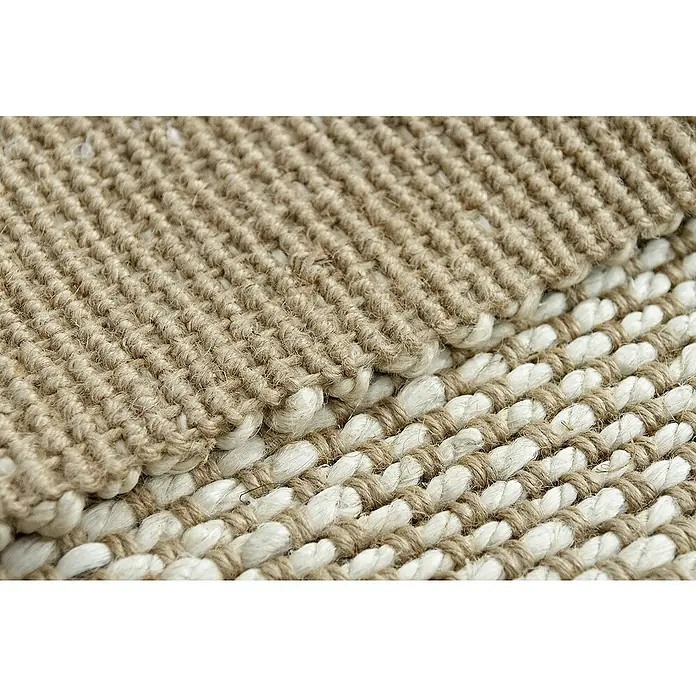 Alfombra de yute Málaga - Blanco/Natural, 300 x 250 cm, 100% yute - Primer plano de una alfombra tejida con fibras beige y blancas, destacando su textura rústica y artesanía.