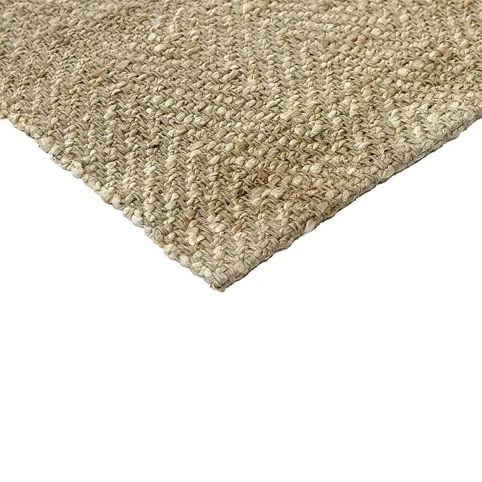 Alfombra de yute Alcázar - Natural, 250 x 250 cm, 100% yute - Primer plano de una alfombra de fibra natural tejida, que muestra su superficie texturizada y tonos cálidos y terrosos, ideal para un toque acogedor.