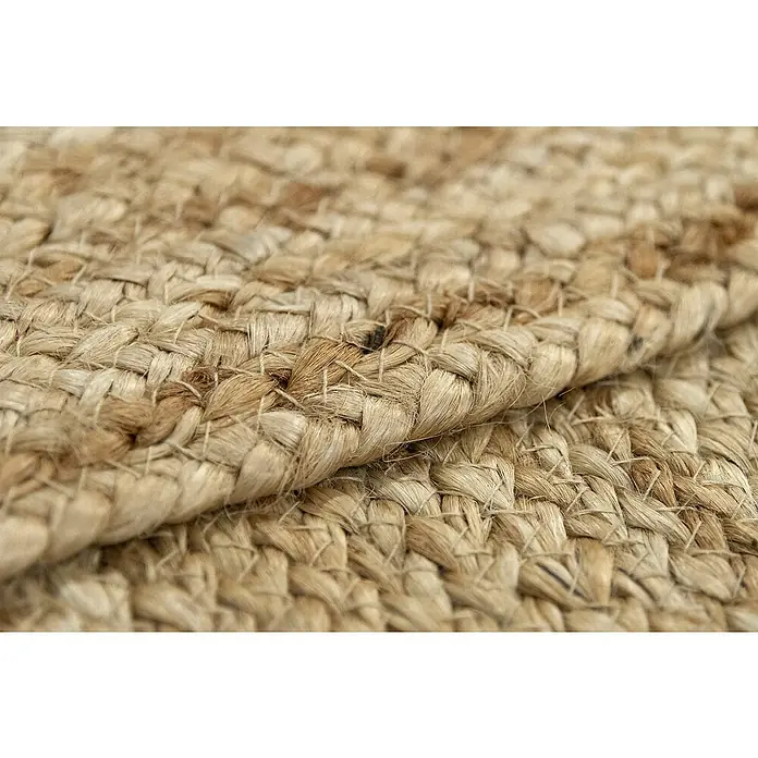 Alfombra de yute Nazar - Beige, 360 x 220 cm - Primer plano de una alfombra de yute trenzado con una textura distinta, mostrando la belleza natural de la alfombra.