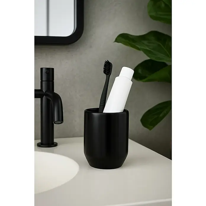 Spirella Jaro Portacepillos - Ø x Al: 7,8 x 10,1 cm, Gres, Negro - Vaso negro con cepillo de dientes y pasta de dientes en un lavabo. Diseño simple para accesorios de baño.