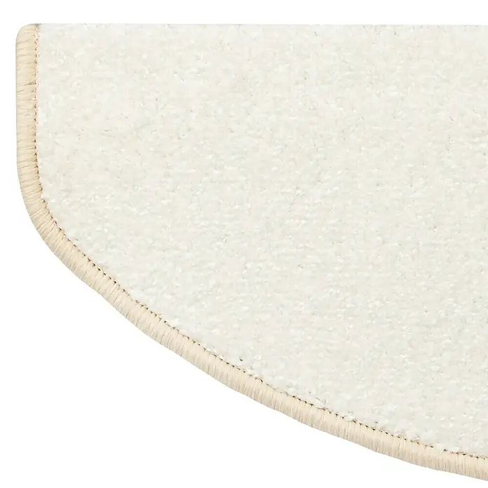Stufenmatte Sundae - 65 x 23,5 cm, Creme, Halbrund - Detailansicht eines cremefarbenen Teppichs mit einer feinen, hellbraunen Umrandung, der eine gemütliche und einladende Atmosphäre ausstrahlt.