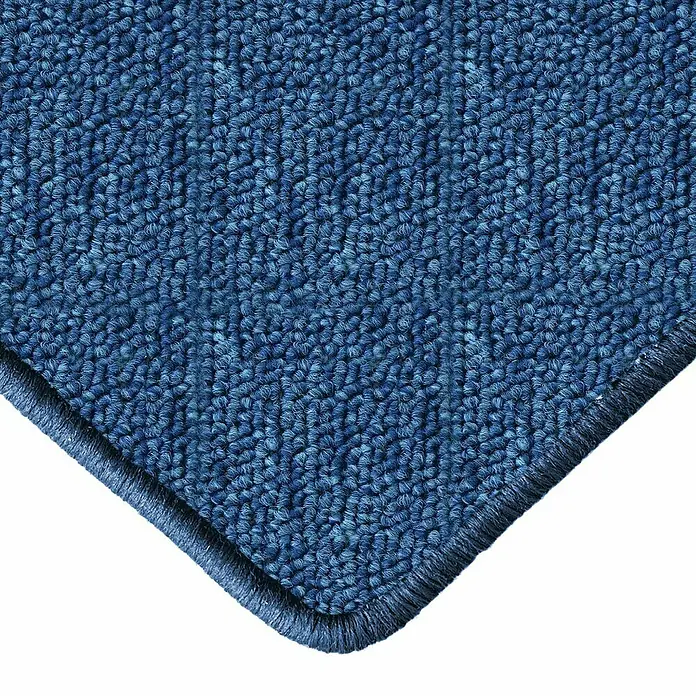 Flachgewebeteppich London - Dunkelblau, 200 x 200 cm, 100 % Polypropylen - Nahaufnahme einer Ecke eines blauen Teppichs. Der Teppich hat eine dichte Textur und eine saubere, abgerundete Kante.