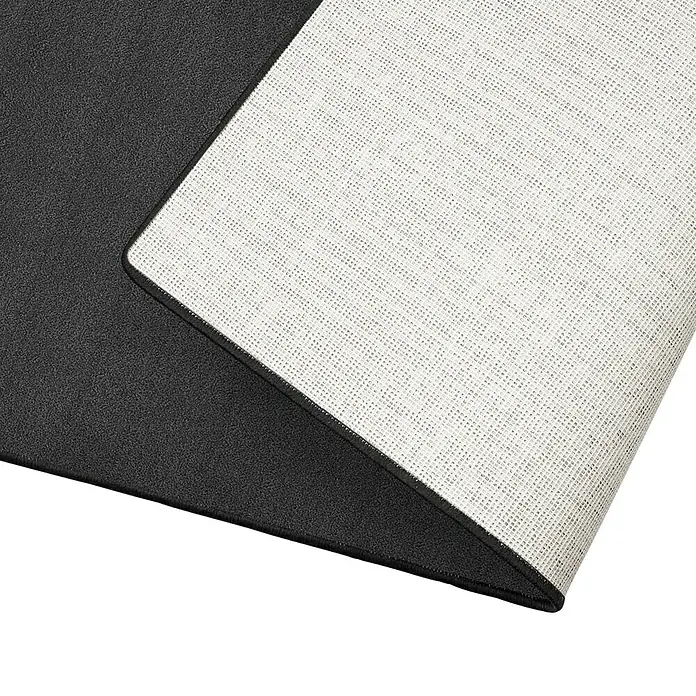 Kurzflorteppich Dynasty - Anthrazit, 100 x 100 cm, 100 % Polypropylen - Nahaufnahme einer schwarzen Fußmatte mit einer weißen, strukturierten Unterseite, die einen Kontrast in Textur und Farbe bietet.