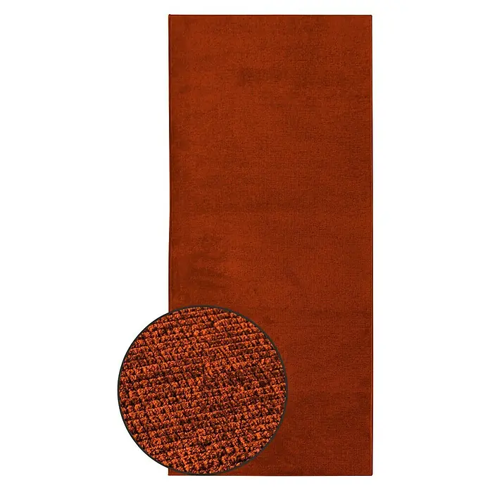 Teppichläufer Azade - Terra, 250 x 80 cm, 65 % Baumwolle, 35 % Polyester - Nahaufnahme eines orangefarbenen Teppichs, der die Textur und die Details des Materials hervorhebt. Der Teppich ist rechteckig und hat eine feine Struktur.