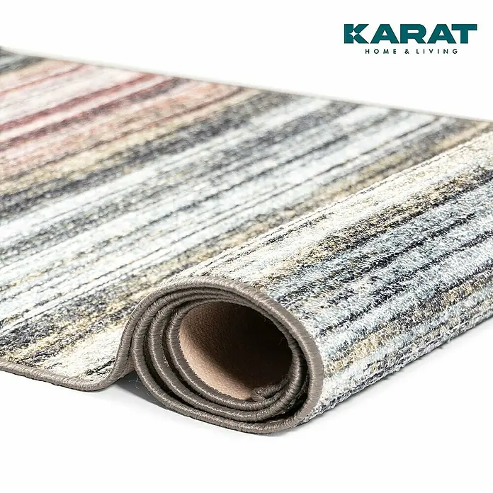 Teppichläufer Cudillero - Bunt, 500 x 80 cm, 100 % Polyamid - Detailansicht eines gerollten Teppichs mit modernem Streifendesign in Grau-, Beige- und Rottönen.