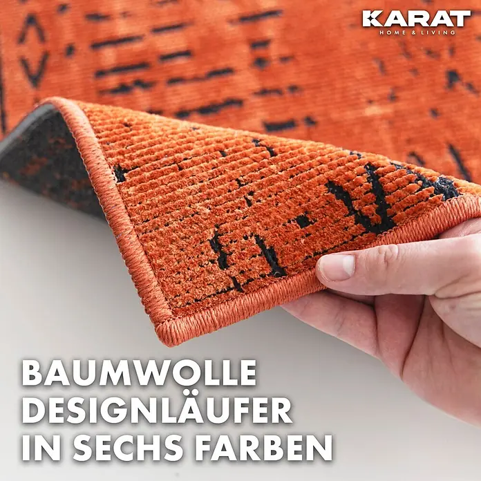 Teppichläufer Vena - Terra, 100 x 80 cm, 65 % Baumwolle, 35 % Polyester - Detailaufnahme eines Baumwoll-Designläufers in Orange mit schwarzem Muster.