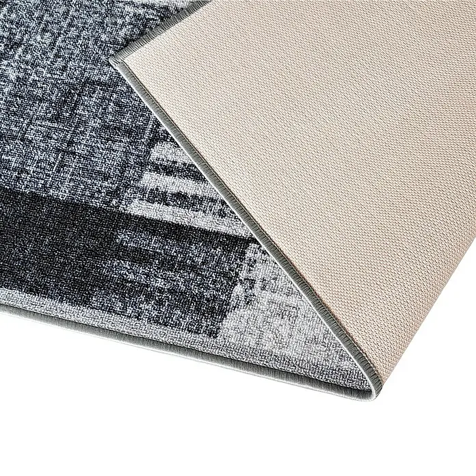 Teppichläufer Cordoba - Grau, 250 x 80 cm, 100 % Polyamid - Nahaufnahme eines abstrakten grauen Teppichs mit beiger Rückseite. Er ist ideal für Wohnzimmer, Schlafzimmer oder Esszimmer und verleiht jedem Raum Stil.