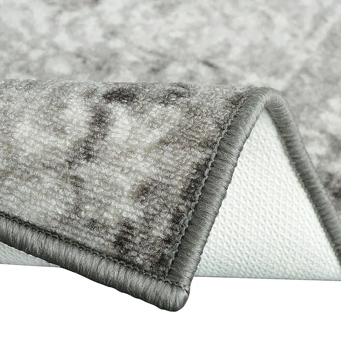 Teppichläufer Palau - Grau, 200 x 80 cm, 100 % Polyamid - Nahaufnahme eines grauen Teppichs mit Muster und grauem Rand, der die Textur und Details des Teppichs hervorhebt.