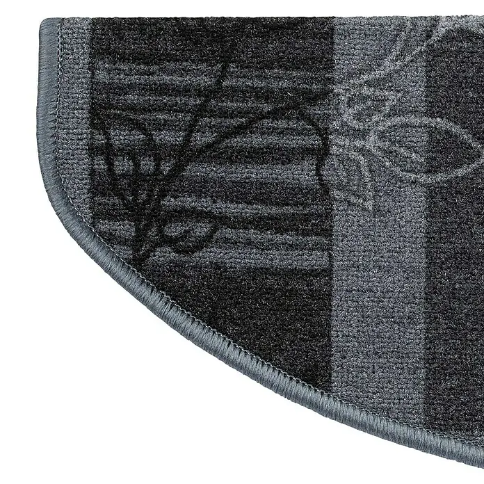 Stufenmatte Akzent - 65 x 23,5 cm, Grau, Halbrund - Ausschnitt einer grauen Teppichmatte mit floralem Muster und abgerundeter Ecke. Ideal für Eingangsbereiche oder als dekoratives Element.