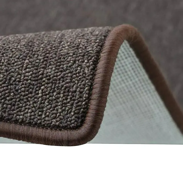 Flachgewebeteppich London - Dunkelbraun, 100 x 100 cm, 100 % Polypropylen - Nahaufnahme eines Teppichs mit brauner Umrandung, der die Textur und die Verarbeitung des Produkts hervorhebt.