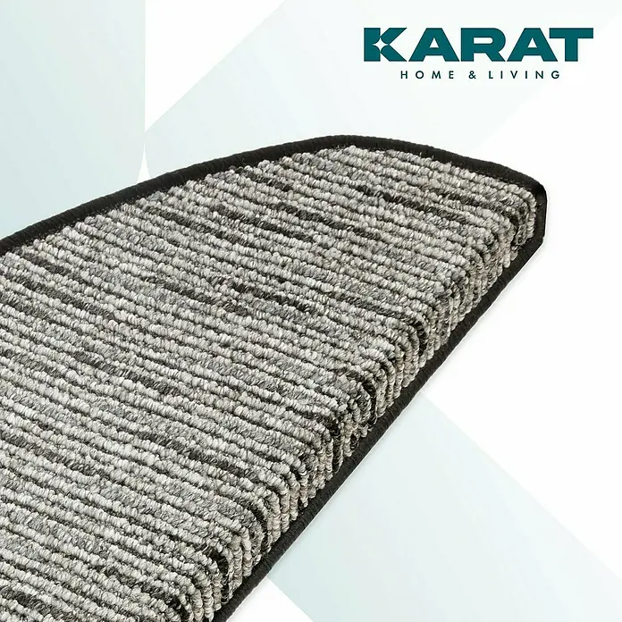 Stufenmatte Geneva - 65 x 23,5 cm, Anthrazit, Halbrund - Detailaufnahme einer grauen, rechteckigen Stufenmatte mit dunkler Umrandung, die Komfort und Sicherheit bietet.
