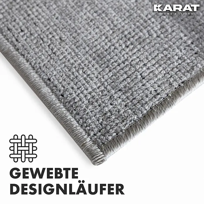 Teppichläufer Azade - Silber, 200 x 80 cm, 65 % Baumwolle, 35 % Polyester - Nahaufnahme eines grauen Läufers mit gewebter Struktur, hervorgehoben durch das Karat Home & Living Logo.