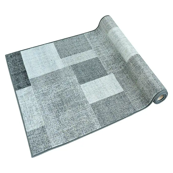 Teppichläufer Lucano - Anthrazit, 350 x 80 cm, 100 % Polyamid - Ein zusammengerollter Teppich mit modernem, quadratischem Design in verschiedenen Grautönen. Ideal für ein stilvolles Zuhause.