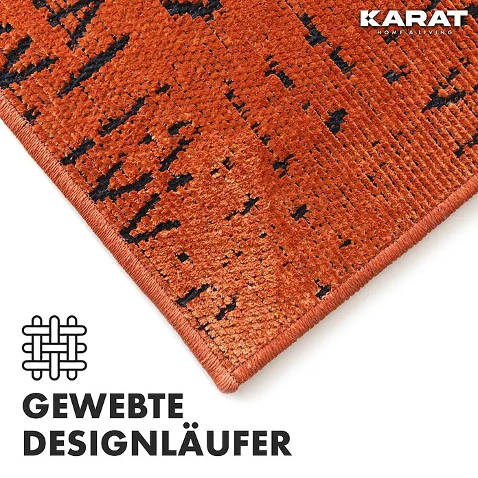 Teppichläufer Vena - Terra, 100 x 80 cm, 65 % Baumwolle, 35 % Polyester - Nahaufnahme eines gewebten Designläufers in Orange mit dunklem Muster und "Karat Home & Living" Logo.