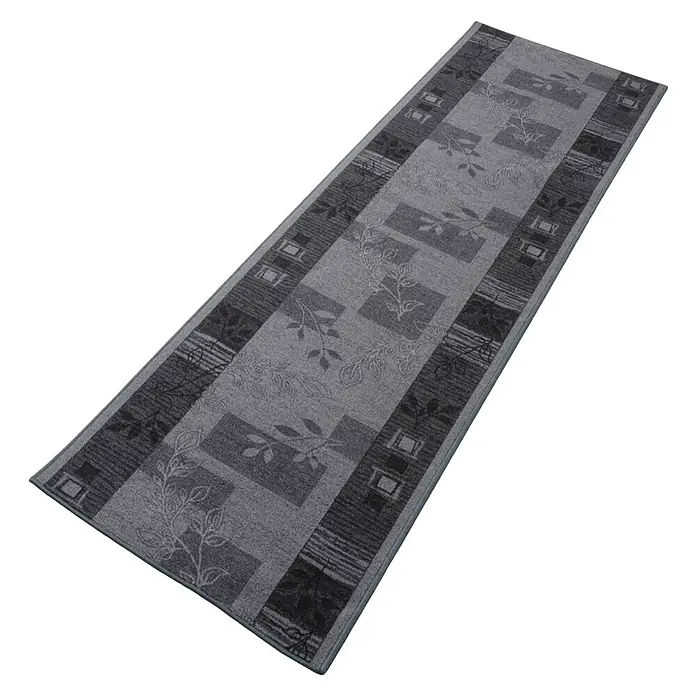 Teppichläufer Akzent - Grau, 100 x 67 cm, 100 % Polyamid - Grauer Teppichläufer mit floralem Muster. Der Teppich ist rechteckig und hat ein modernes Design mit verschiedenen Grautönen und Pflanzenmotiven.