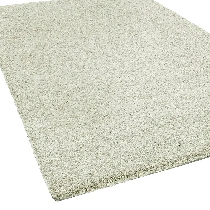 Hochflorteppich Barcelona - Creme, 200 x 200 cm, 100 % Polypropylen - Nahaufnahme eines hellen, flauschigen Teppichs, der Textur und Komfort betont. Ideal, um jedem Raum Wärme zu verleihen.