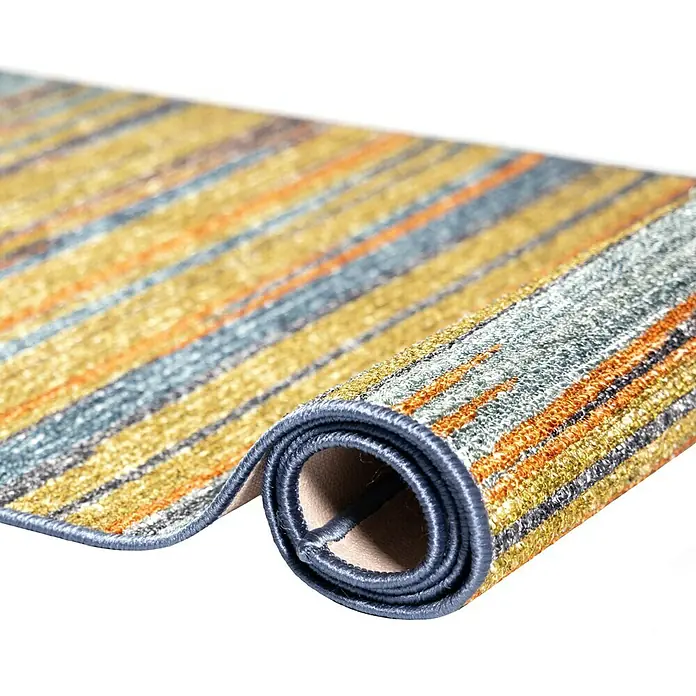 Teppichläufer Calama - Bunt, 250 x 80 cm, 100 % Polyamid - Ein aufgerollter Teppich mit bunten Streifen in Gelb, Blau und Orange, der ein modernes und stilvolles Design zeigt.