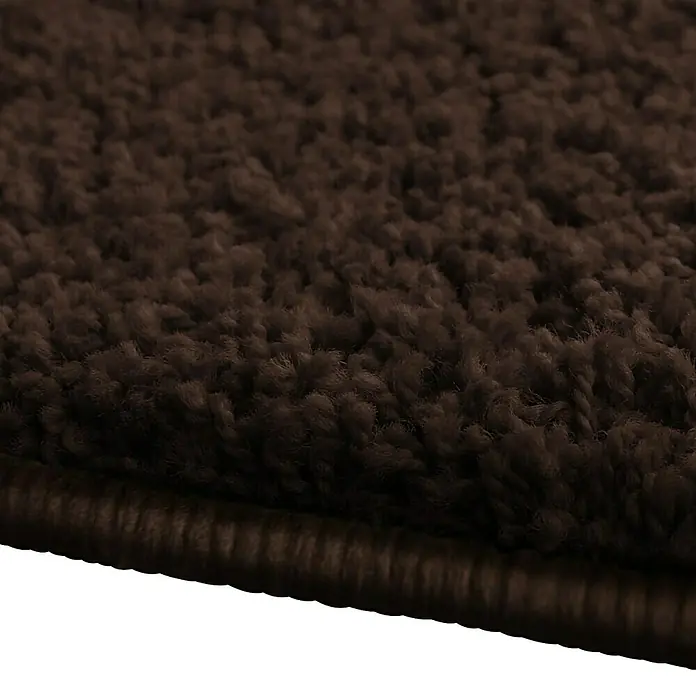 Hochflorteppich Barcelona - Dunkelbraun, 100 x 100 cm, 100 % Polypropylen - Nahaufnahme eines braunen Shaggy-Teppichs, der eine weiche Textur und einen dicken Flor zeigt. Ideal für Komfort und Wärme im Wohnbereich.